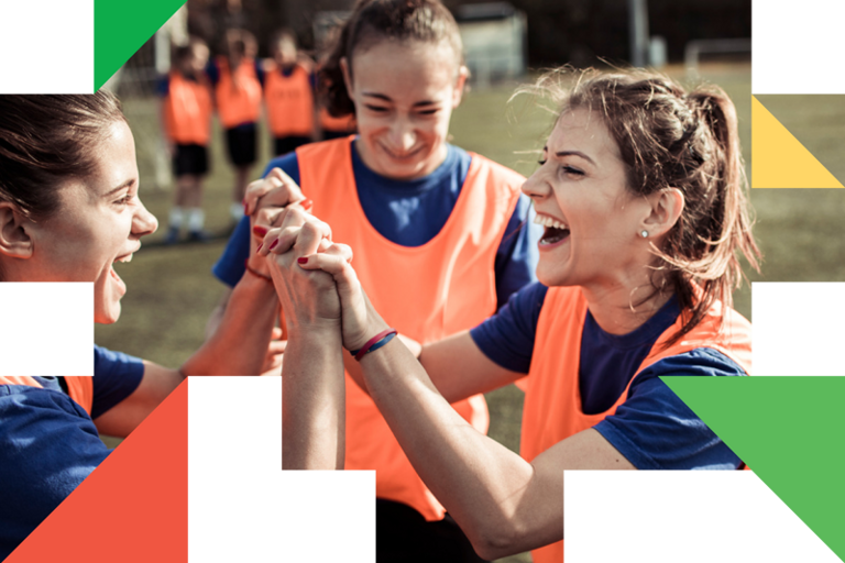A group of young women holding hands in front of each other.