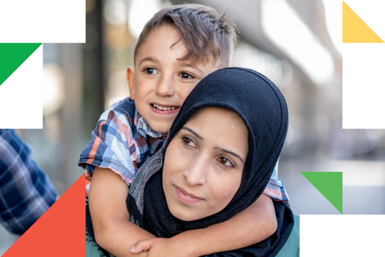 A woman holding a child in her arms.