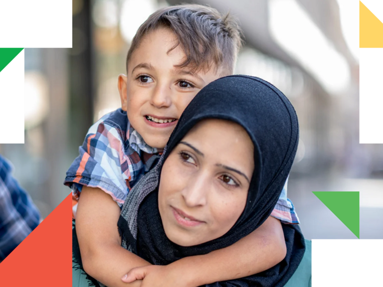 A woman holding a child in her arms.