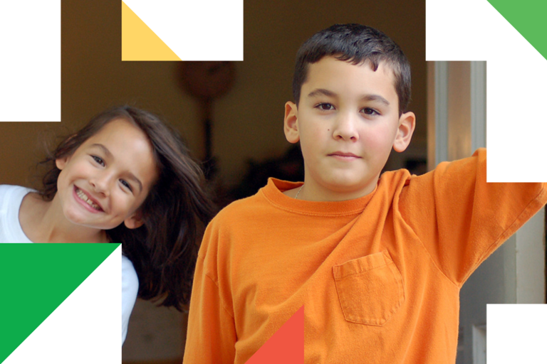 A couple of kids standing next to each other.